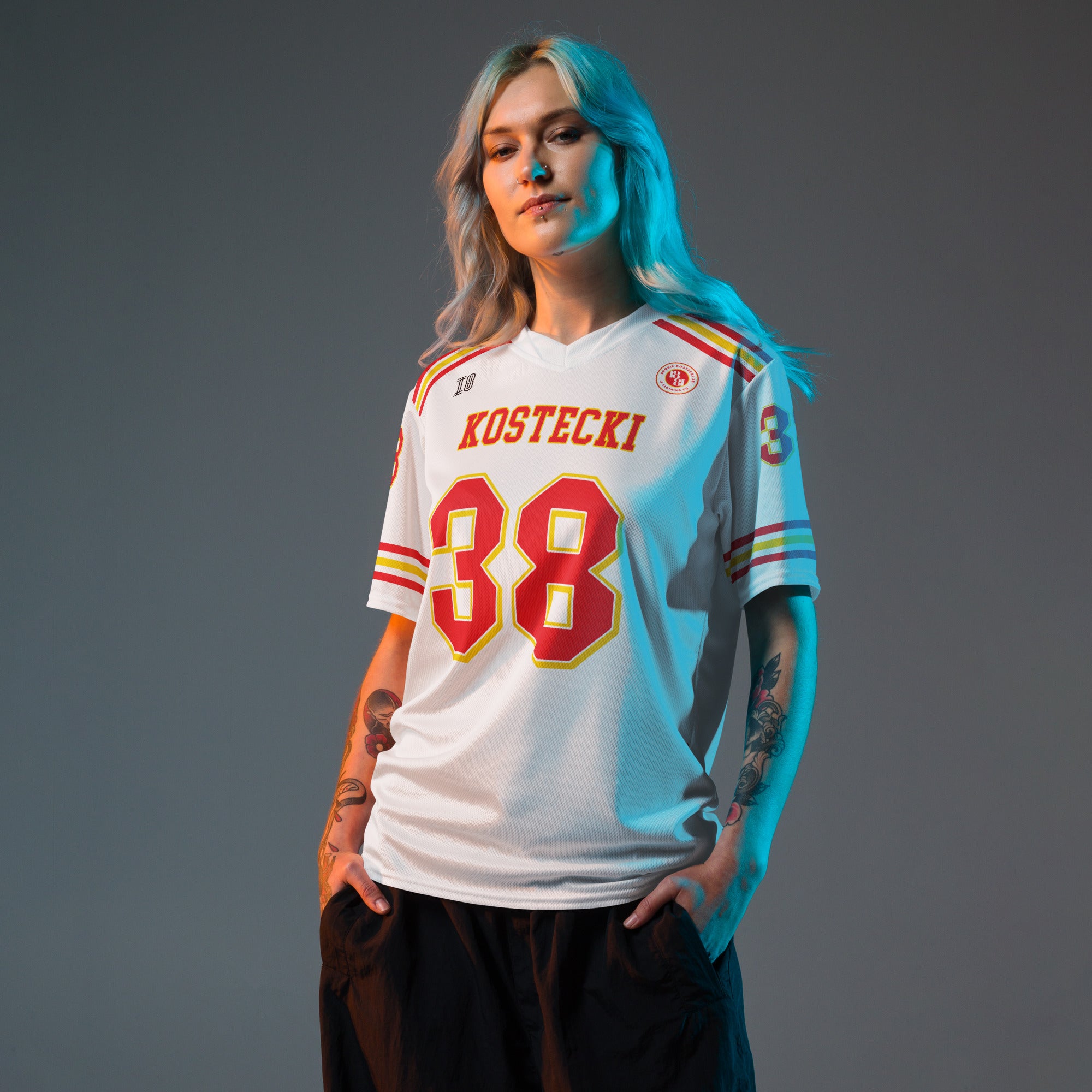 Person wearing a sports jersey with 'Kostecki' and number '88' on a gray background