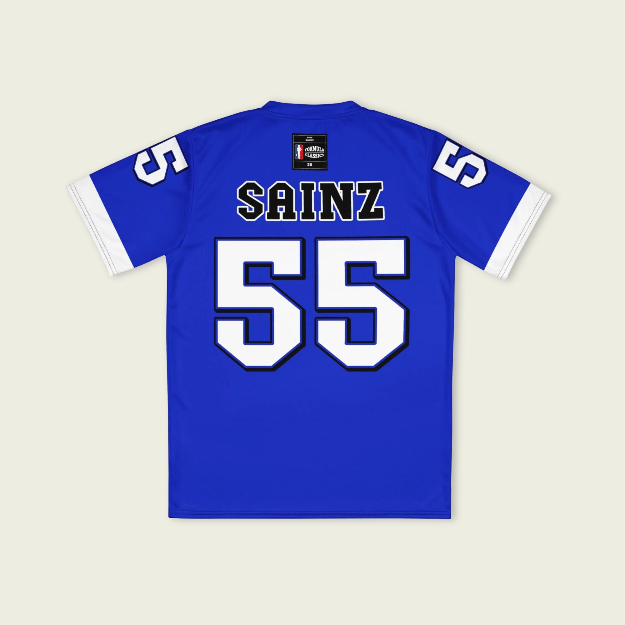 A blue and white football jersey with Carlos Sainz's Williams F1 racing number 55 on the back and front in white. It has the name sainz in white on the front and back as well.