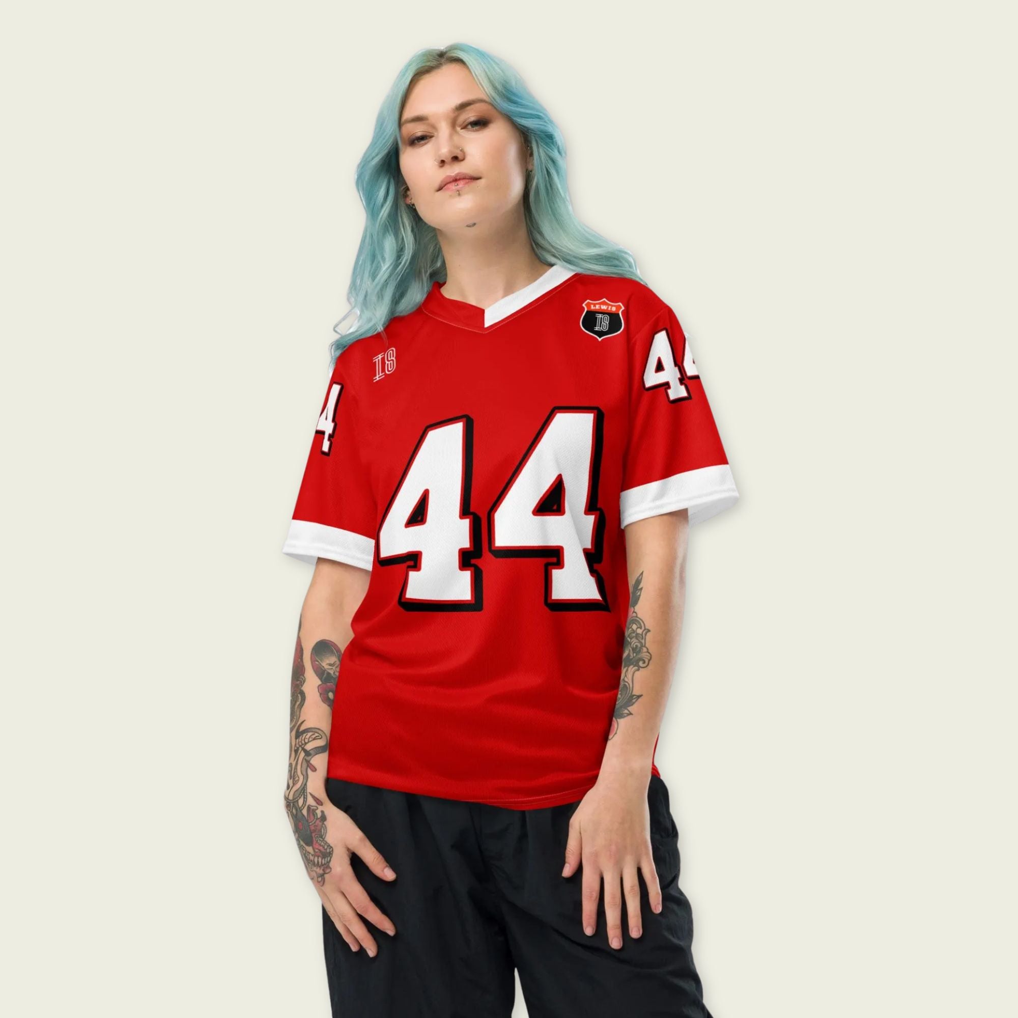 A red and white football jersey with Lewis Hamilton's Ferrari  F1 racing number 44 on the back and front in white. It has the name Hamilton in red on the front and back as well.