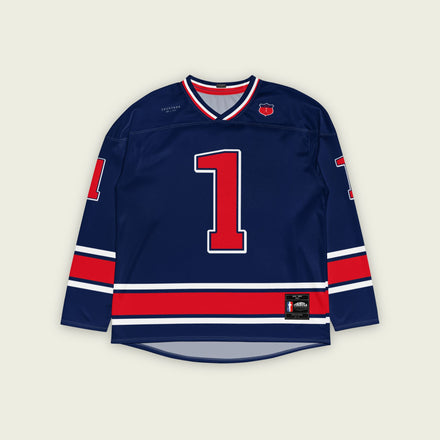 A navy blue and redhockey jersey with orange stripes at the bottom, and Max Verstappen's F1 racing number 1 on the front and back.