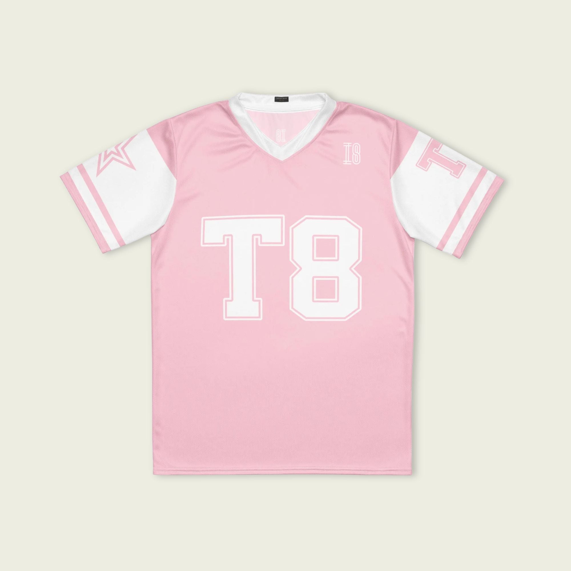 A pink and white football jersey with Tate Mcare on the back and front in white with a white outline.