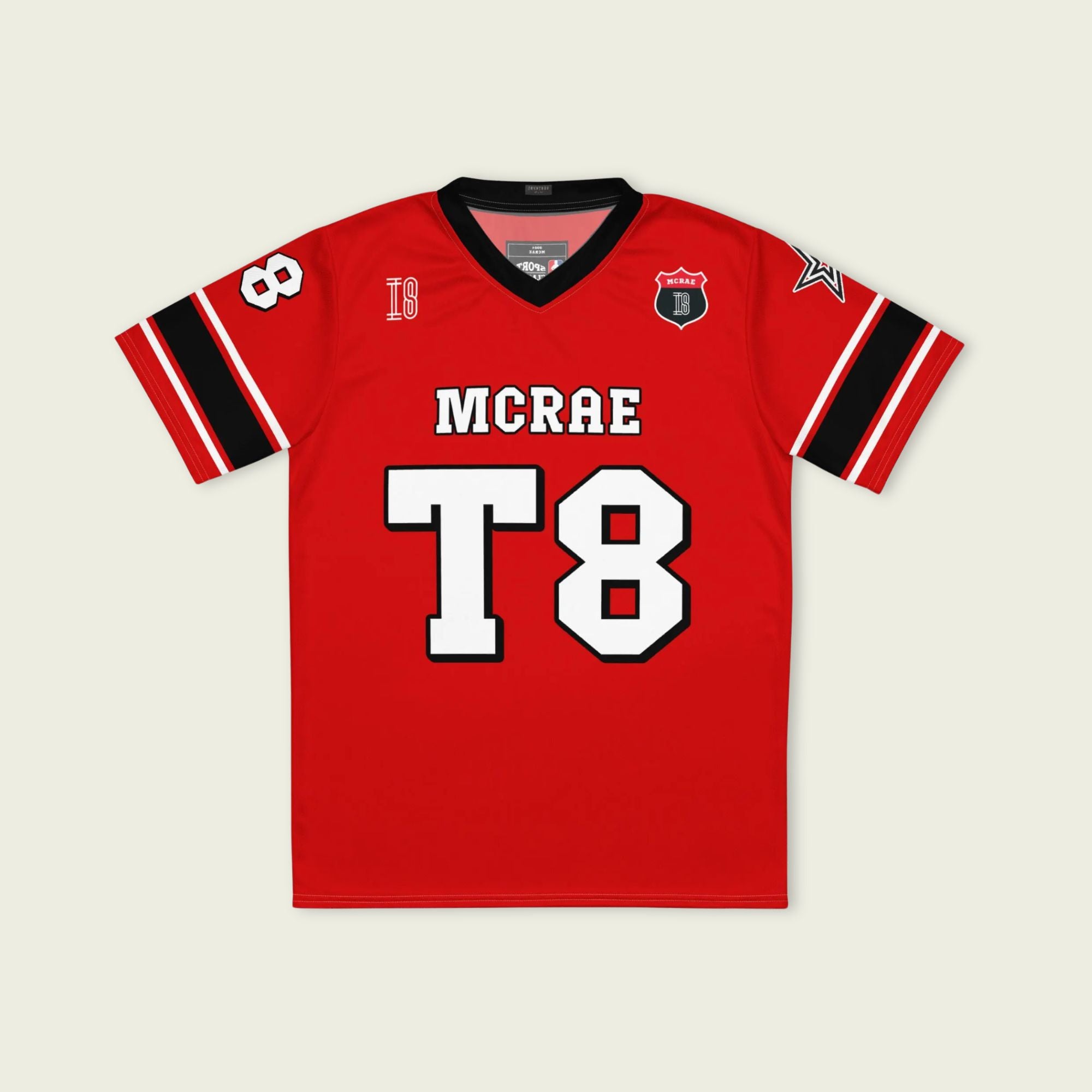 A red, black, and white football jersey with Tate Mcare on the back and front in white with a white outline.