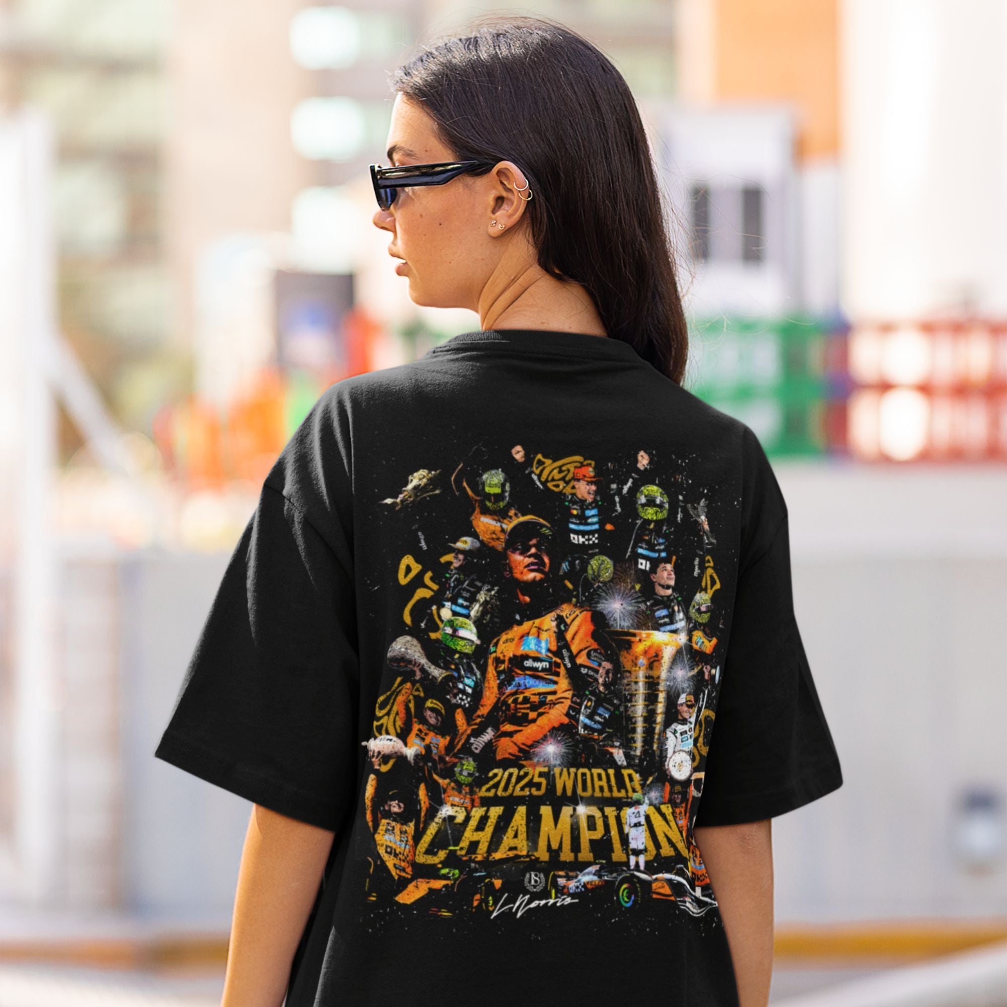 Person wearing a black t-shirt with a colorful graphic and '2025 World Champion' text.