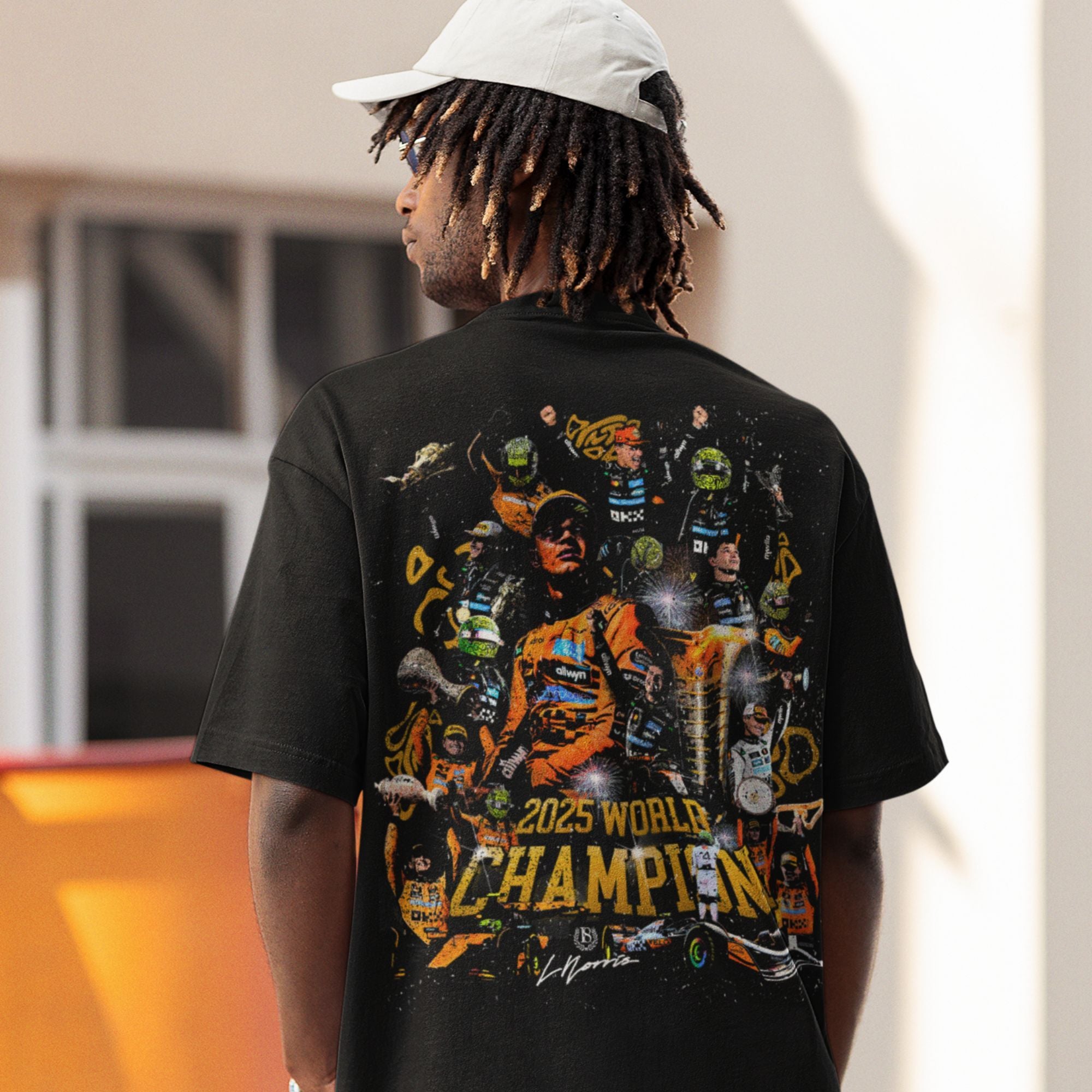 Person wearing a black t-shirt with a colorful graphic and '2025 World Champion' text.