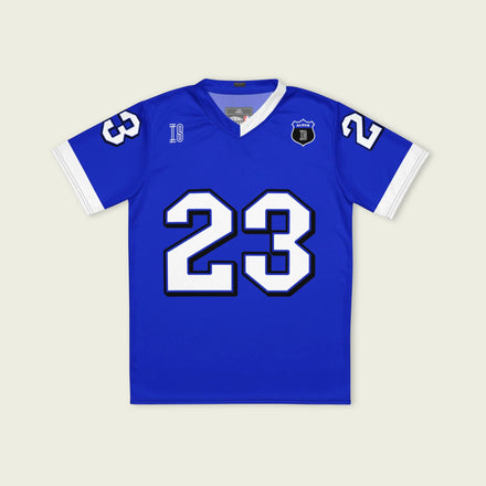 A blue and white football jersey with Alex Albon's Williams F1 racing number 23 on the back and front in white. It has the name Hamilton in red on the front and back as well.