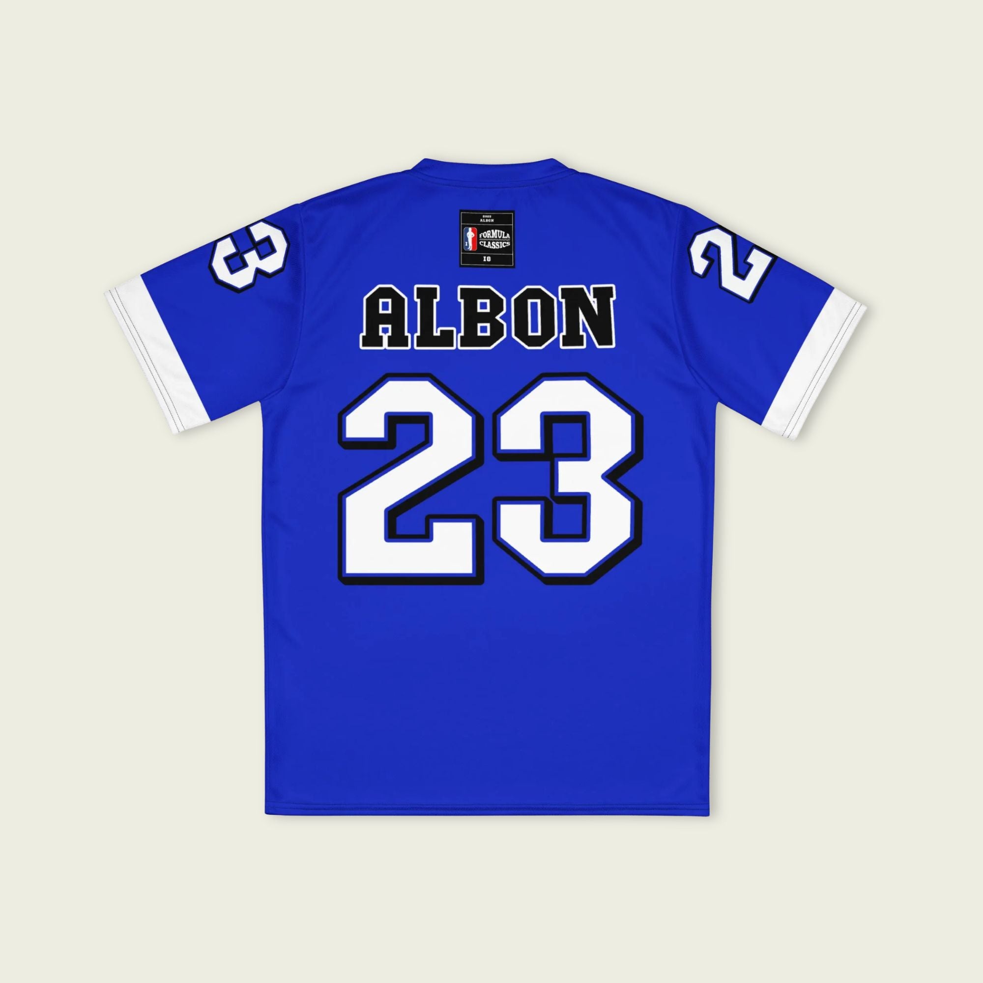 A blue and white football jersey with Alex Albon's Williams F1 racing number 23 on the back and front in white. It has the name Hamilton in red on the front and back as well.