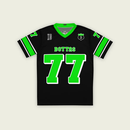 A black and highlight green football jersey with Valteri Bottas's Kick Stake F1 racing number 77 on the front and back in green.