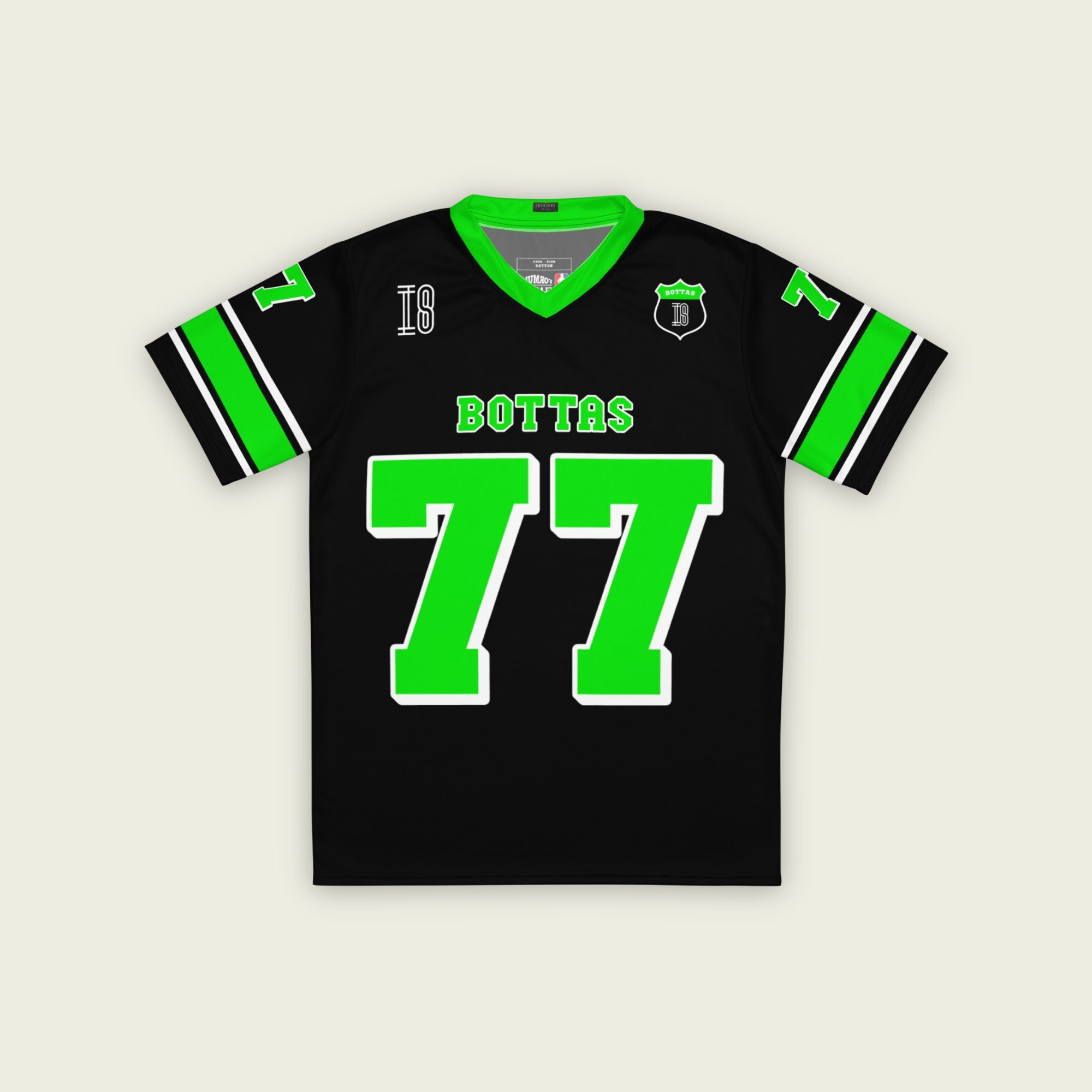 A black and highlight green football jersey with Valteri Bottas's Kick Stake F1 racing number 77 on the front and back in green.