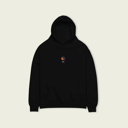 A black oversized hoodie with white text Carlos Sainz's racing number 55 on the front and Sainz's graphic helmut on the front.