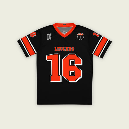 A black and red football jersey with Charles Leclerc's Ferrari F1 Racing number 16 on the front and back. The name Leclerc is on the front and back.