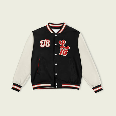 A black, red, and tan, varsity jacket with Charles Leclerc's Ferrari F1 racing number 16 in red on the front and back.