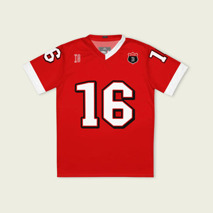 A red and white football jersey with Charles Leclerc's Ferrari  F1 racing number 16 on the back and front in white. It has the name Leclerc in black on the front and back as well.