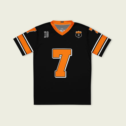 A black and orange football jersey with Christian Lundgaard Arrow McLaren Indycar racing number 7 in orange.