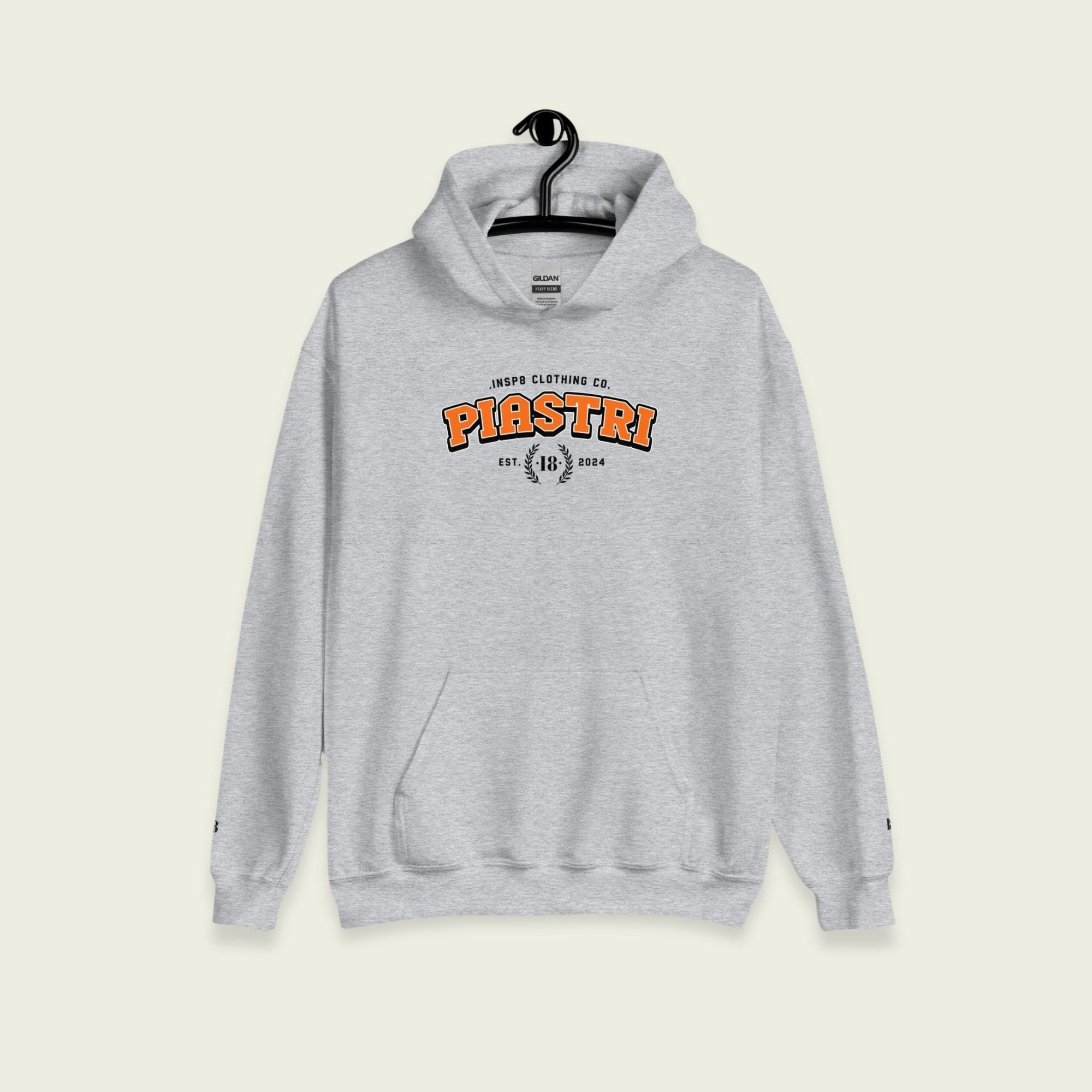 A gray varsity hoodie with Oscar Piastri's name on the front in papaya orange on the front.