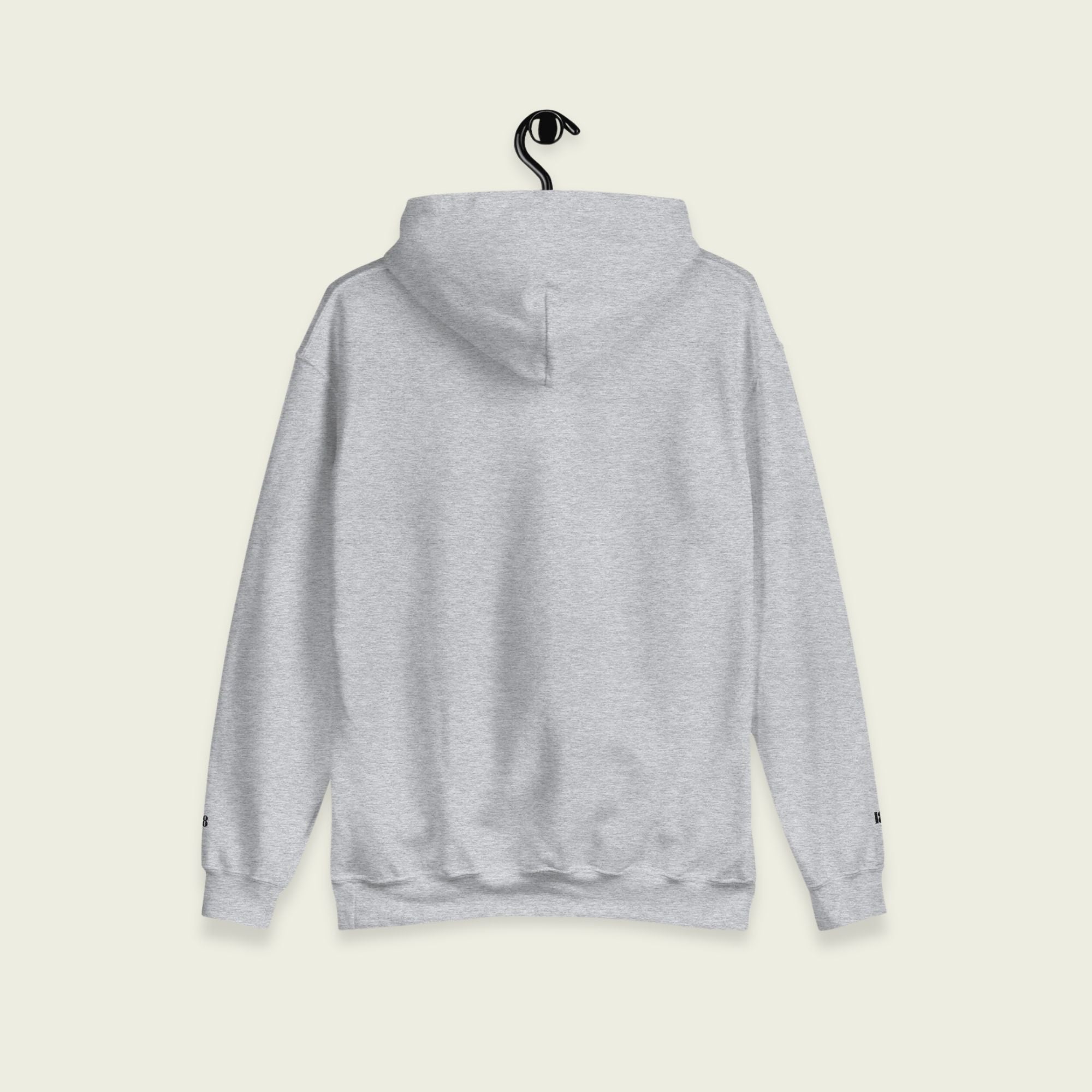A gray varsity hoodie with Oscar Piastri's name on the front in papaya orange on the front.
