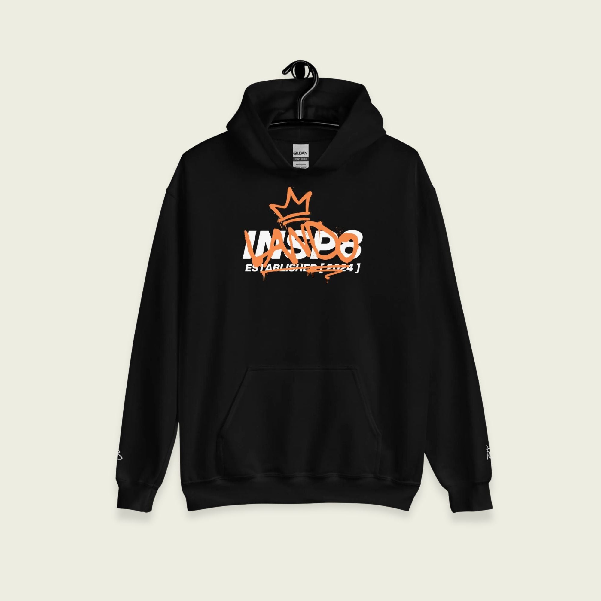 A black hoodie with the text Lando in paparay orange on the front in a spray paint font.