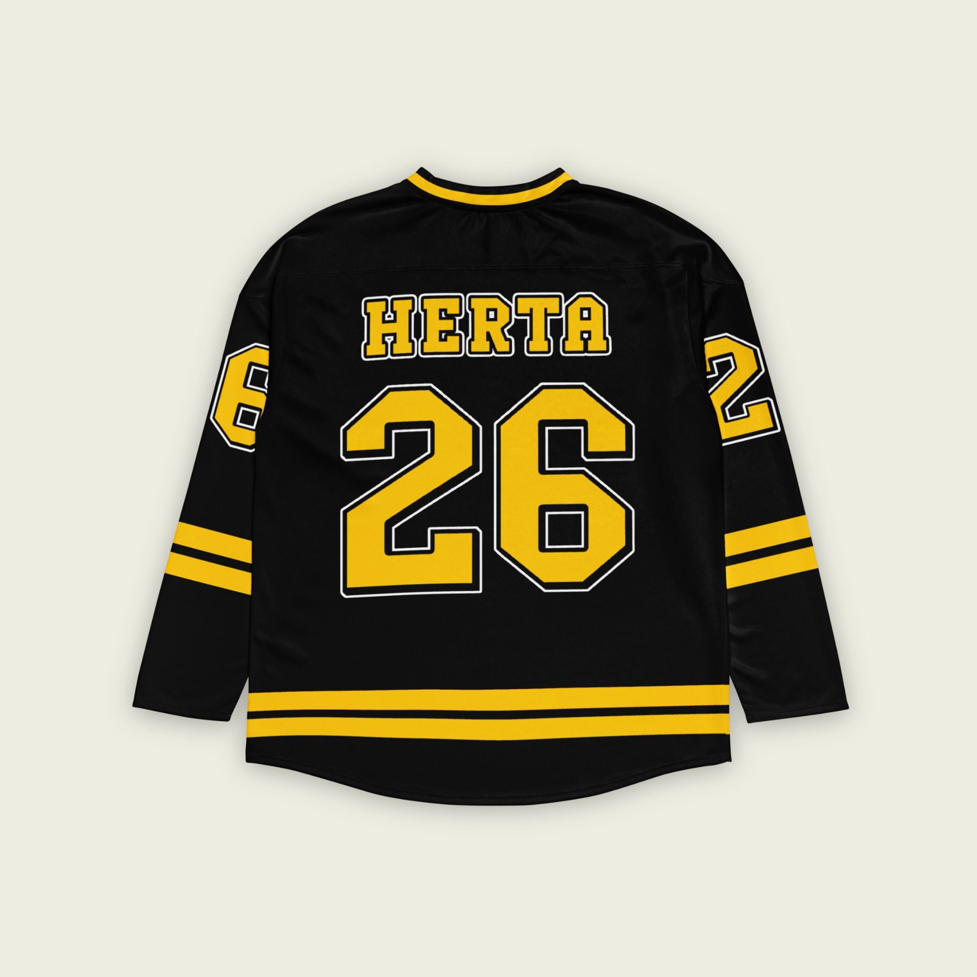 A black hockey jersey with yellow stipes at the bottom and the sleeves. It has the Indycar driver Colton Herta's race number 26 on the front and the back. It also has the name Herta on the front and the back both in yellow with a whilte outline.