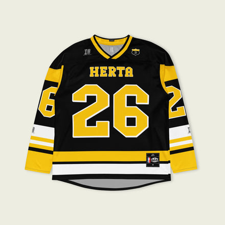 A black hockey jersey with yellow stipes at the bottom and the sleeves. It has the Indycar driver Colton Herta's race number 26 on the front and the back. It also has the name Herta on the front and the back both in yellow with a whilte outline.