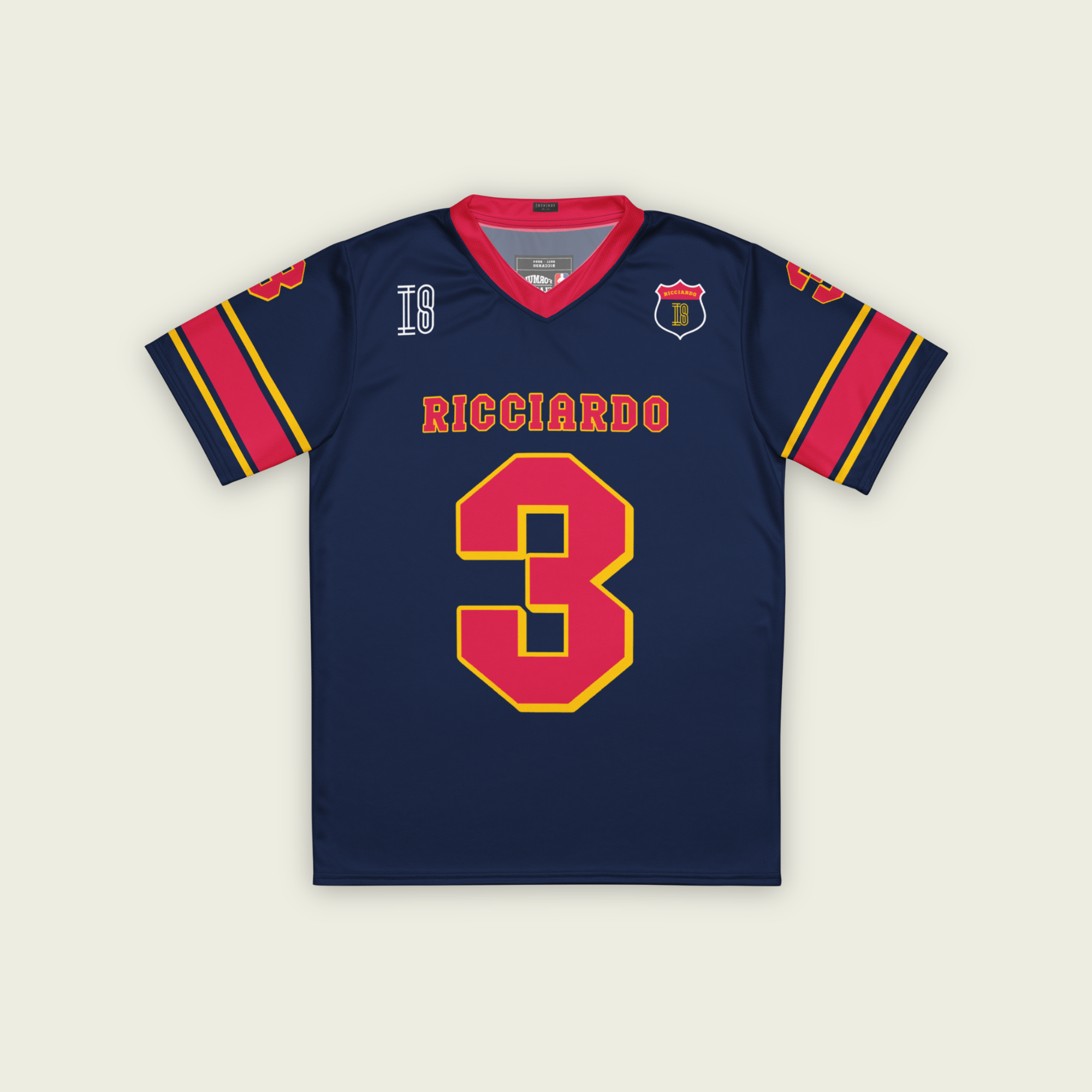 A navy blue and red football jersey with Daniel Ricciardo's Redbull F1 racing number in red on the front and back.