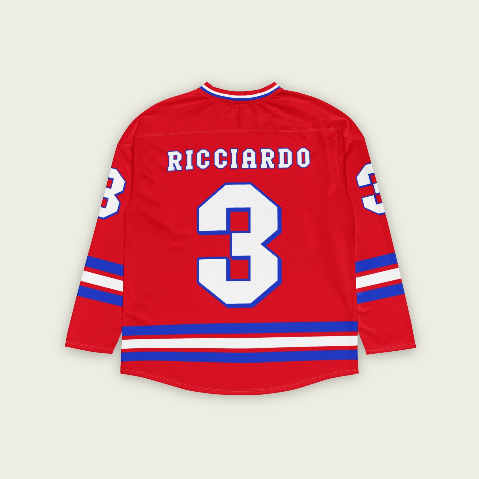 A red and blue hockey jersey with Daniel RIcciardo's redbull f1 racing number 3 on the front and back in white. It has the name Ricciardo in white on the front and back with a blue outline.