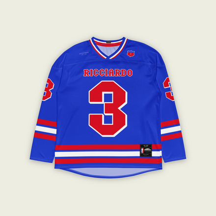A blue and red hockey jersey with daniel ricciardo's VCARB F1 racing number in red. It has the name Ricciardo on the front and back in red.