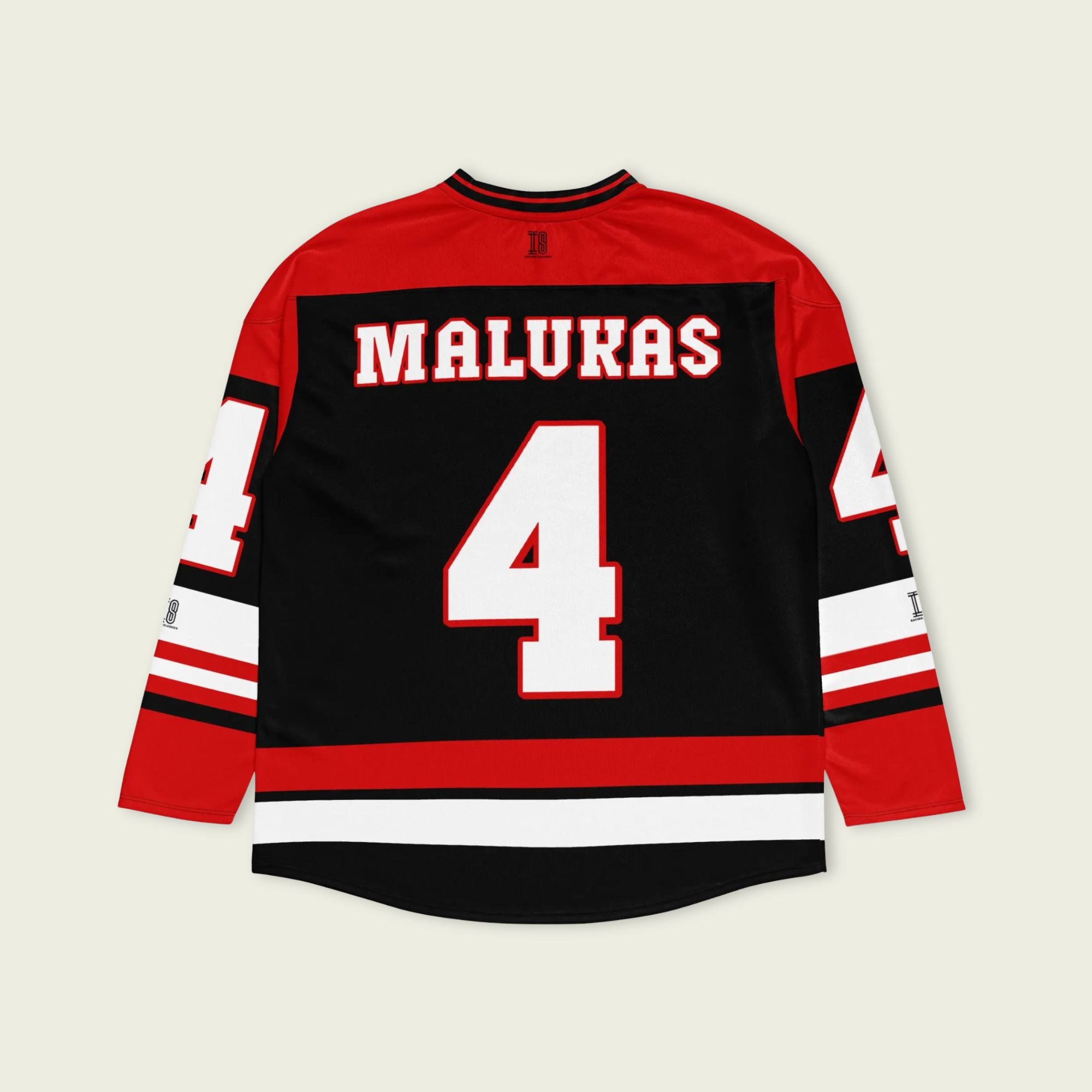 A black, red and white hockey jersey with David Malukas's name and indycar racing number 4 on the front and back in white with a red outline.