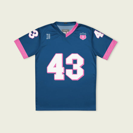 A navy blue and pink football jersey with Franco Colapinto's Alpine F1 Racing number 43 in white on the front and back.