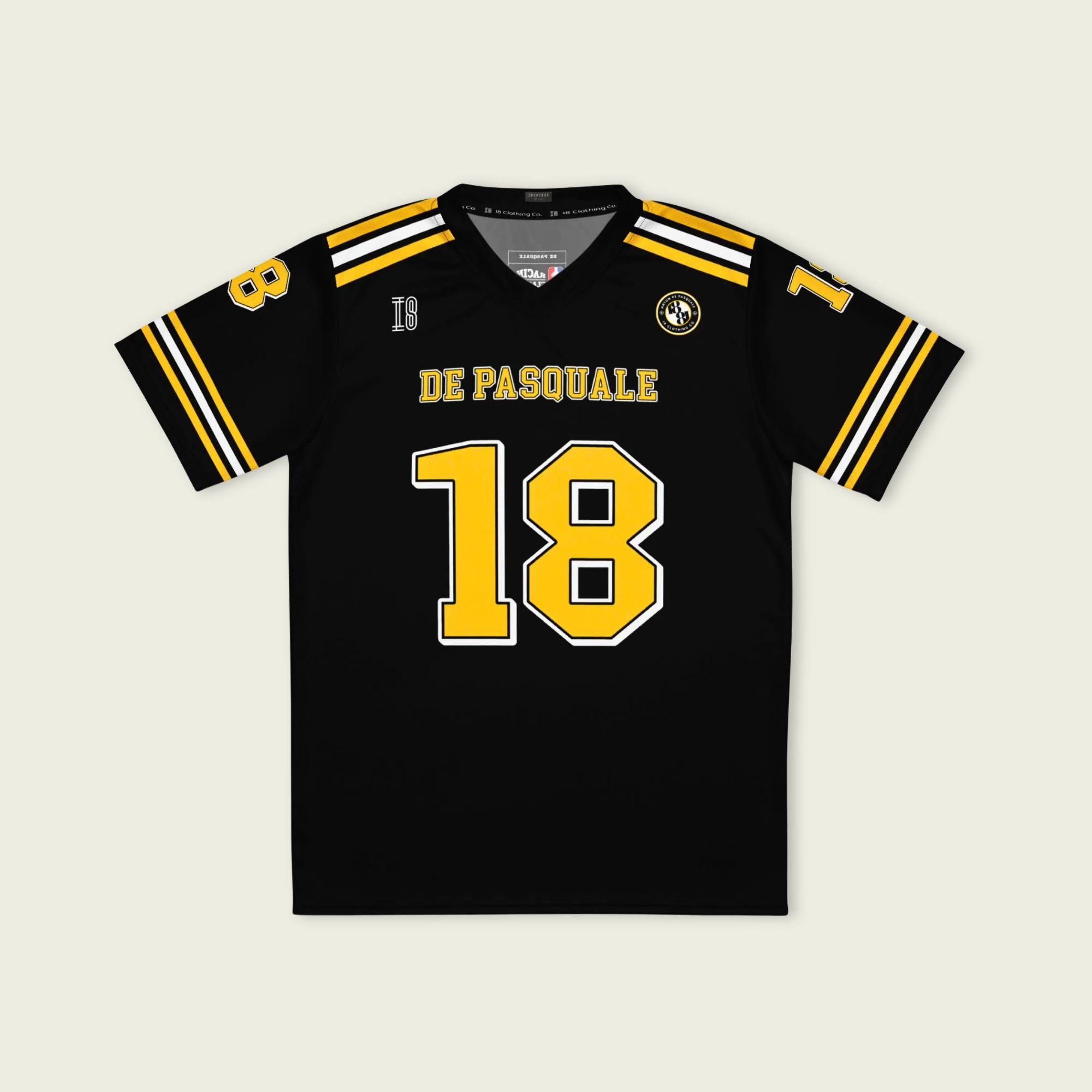 Black sports jersey with yellow and white details, featuring the name 'De Pasquale' and number '18'.