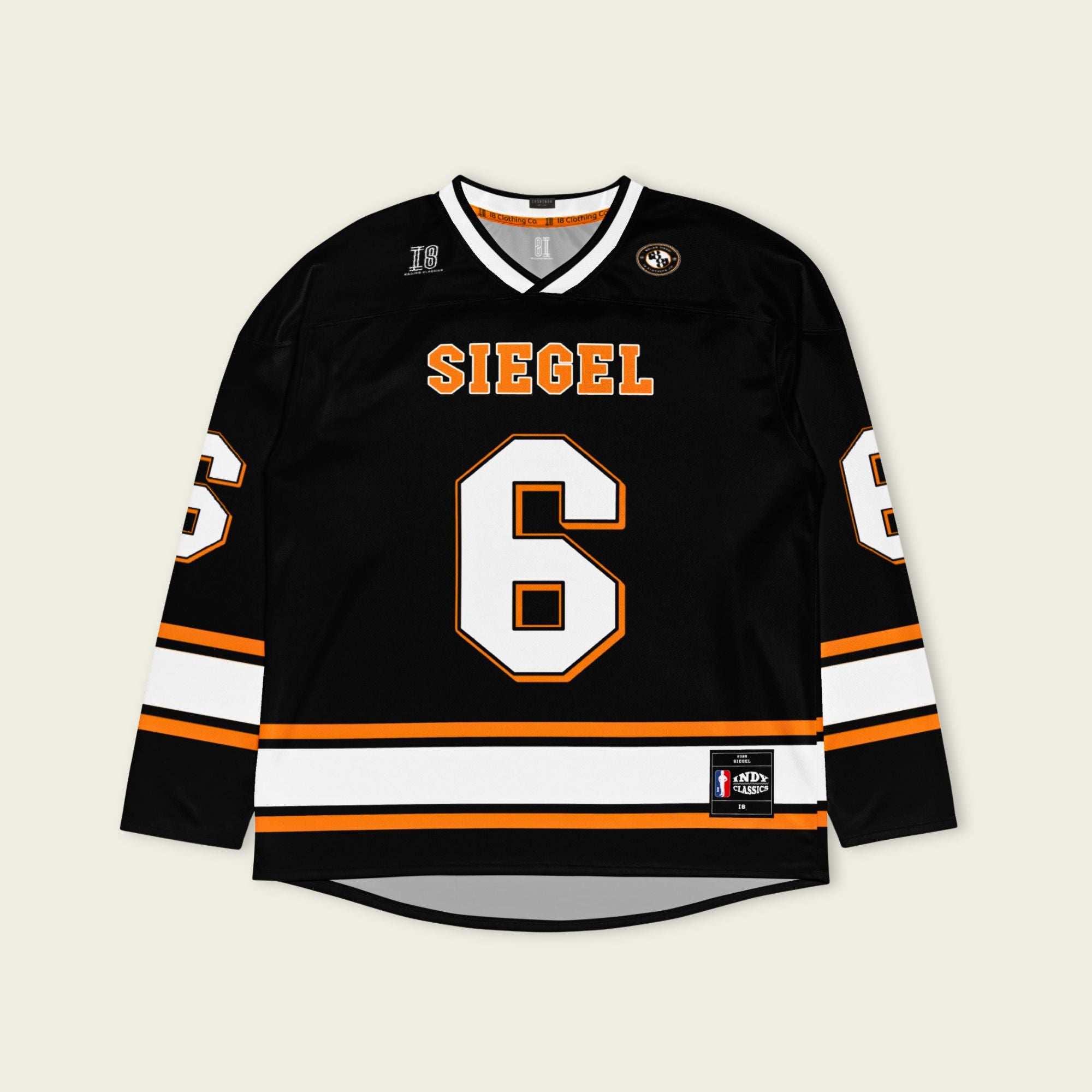 Black hockey jersey with 'SIEGEL' and number '6' on a beige background