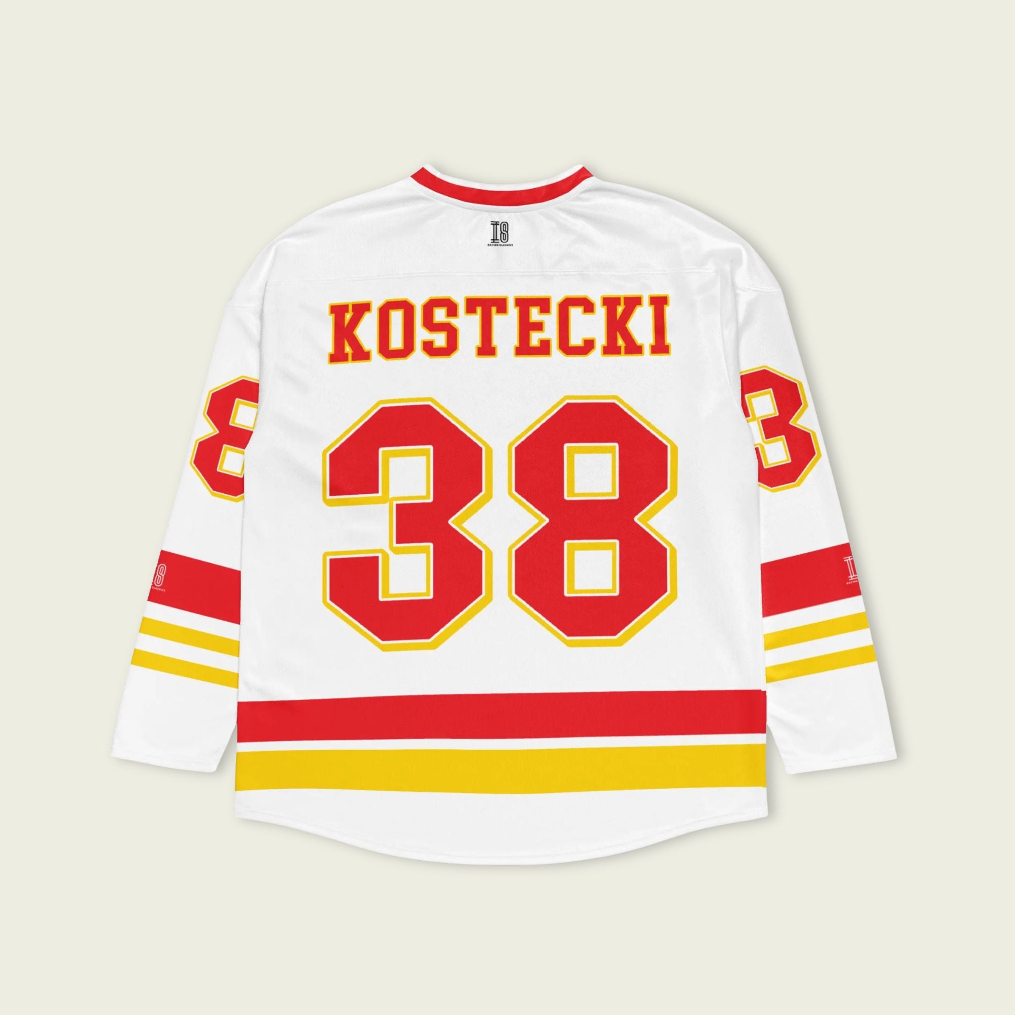 White hockey jersey with red and yellow accents featuring the name 'Kostecki' and number '38'.