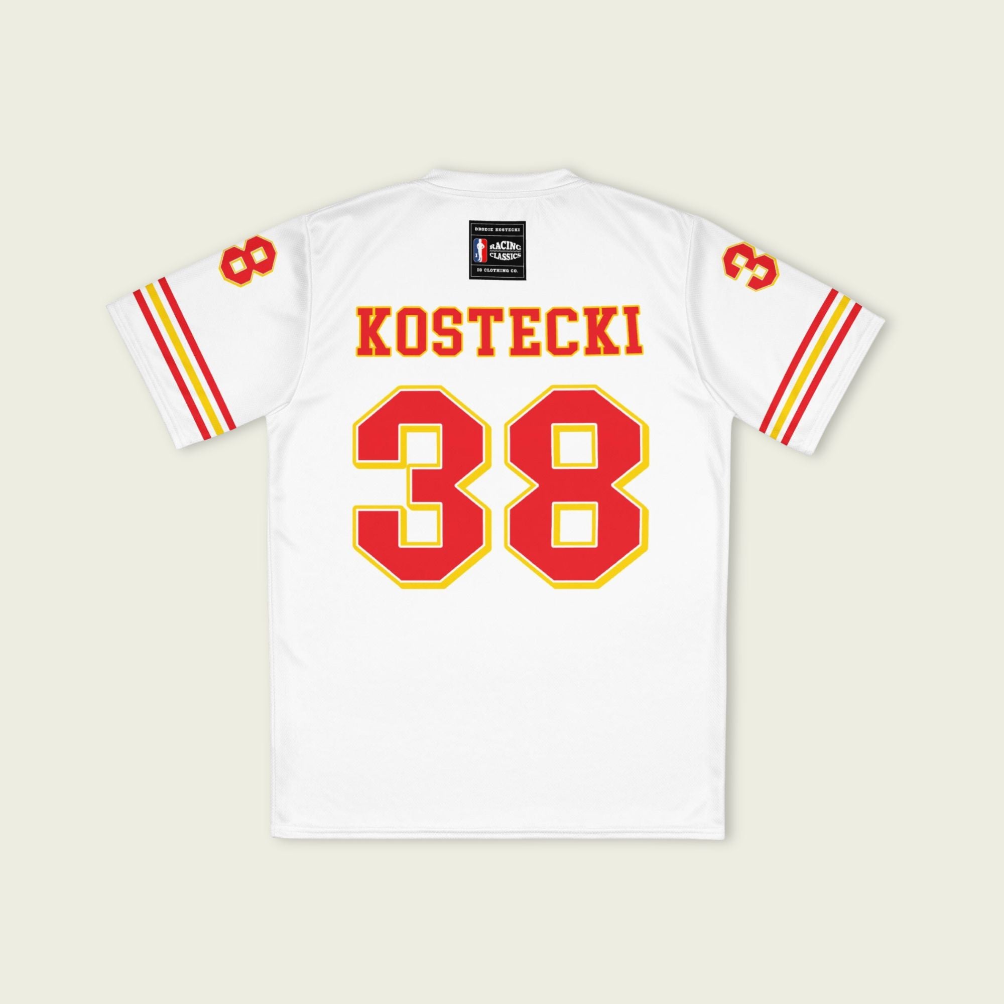 White sports jersey with red and yellow details, featuring the name 'Kostecki' and number '38'.