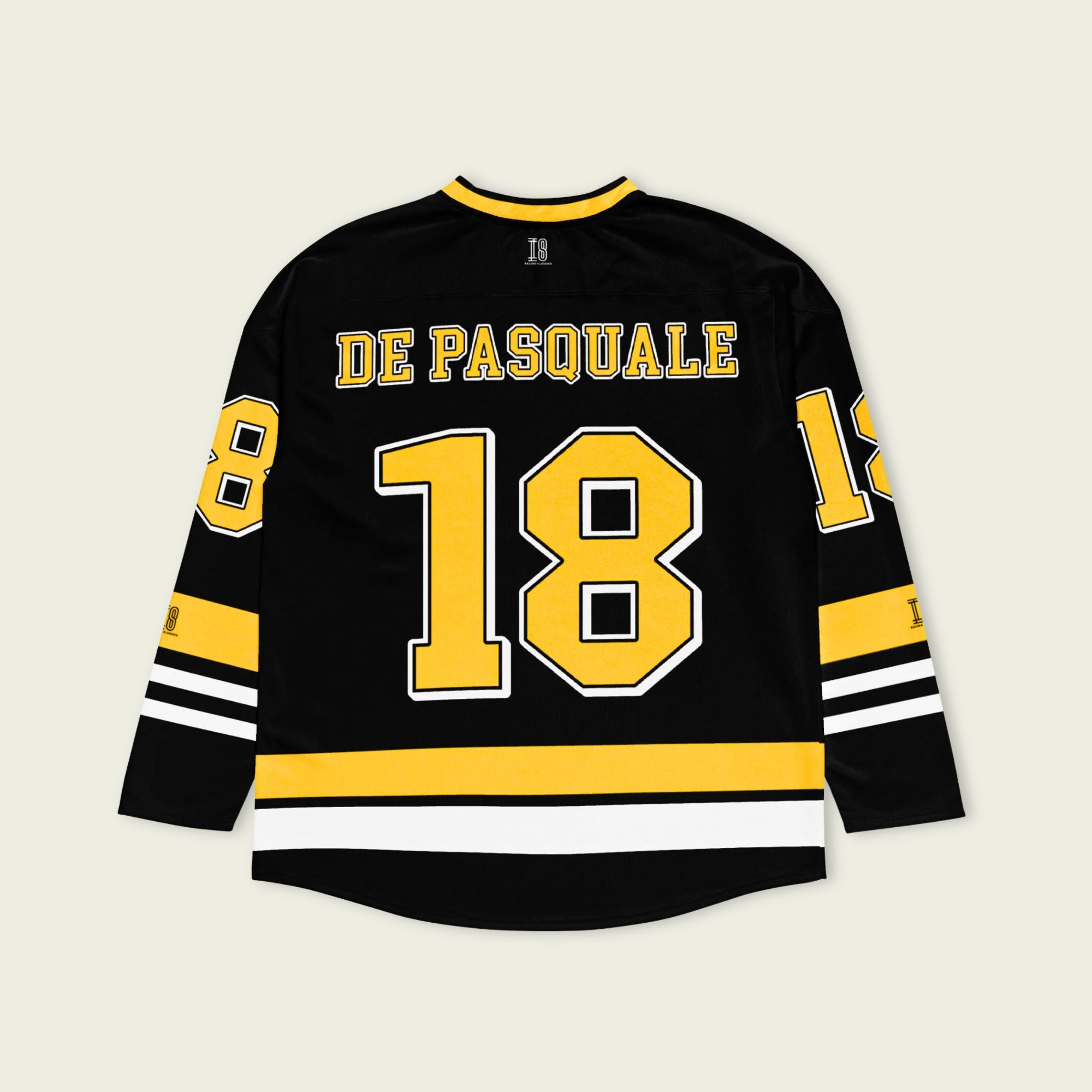 Black hockey jersey with yellow and white details, featuring the name 'De Pasquale' and number '18'.