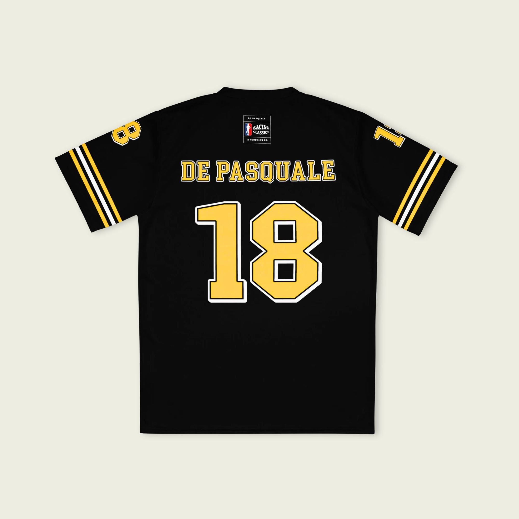 Black sports jersey with yellow text and numbers on a beige background
