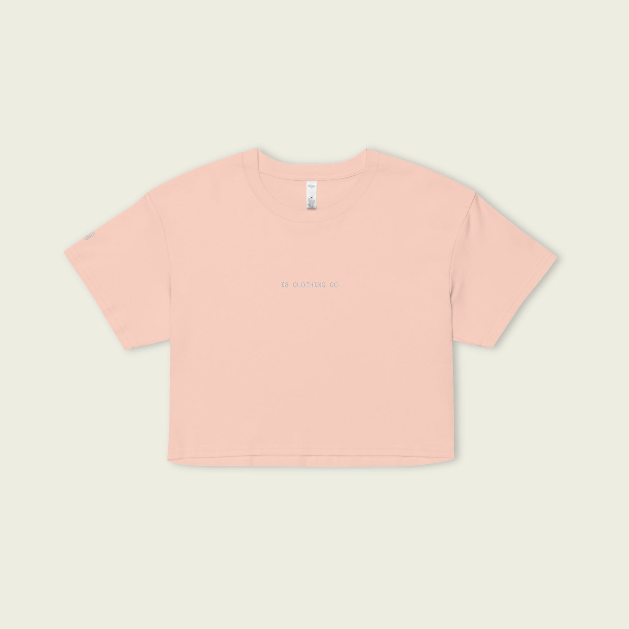 Pink t-shirt on a light beige background