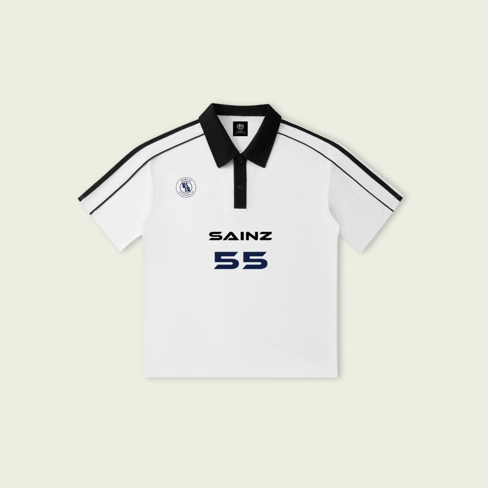 White polo shirt with black accents and 'SAINZ 55' branding on a light beige background
