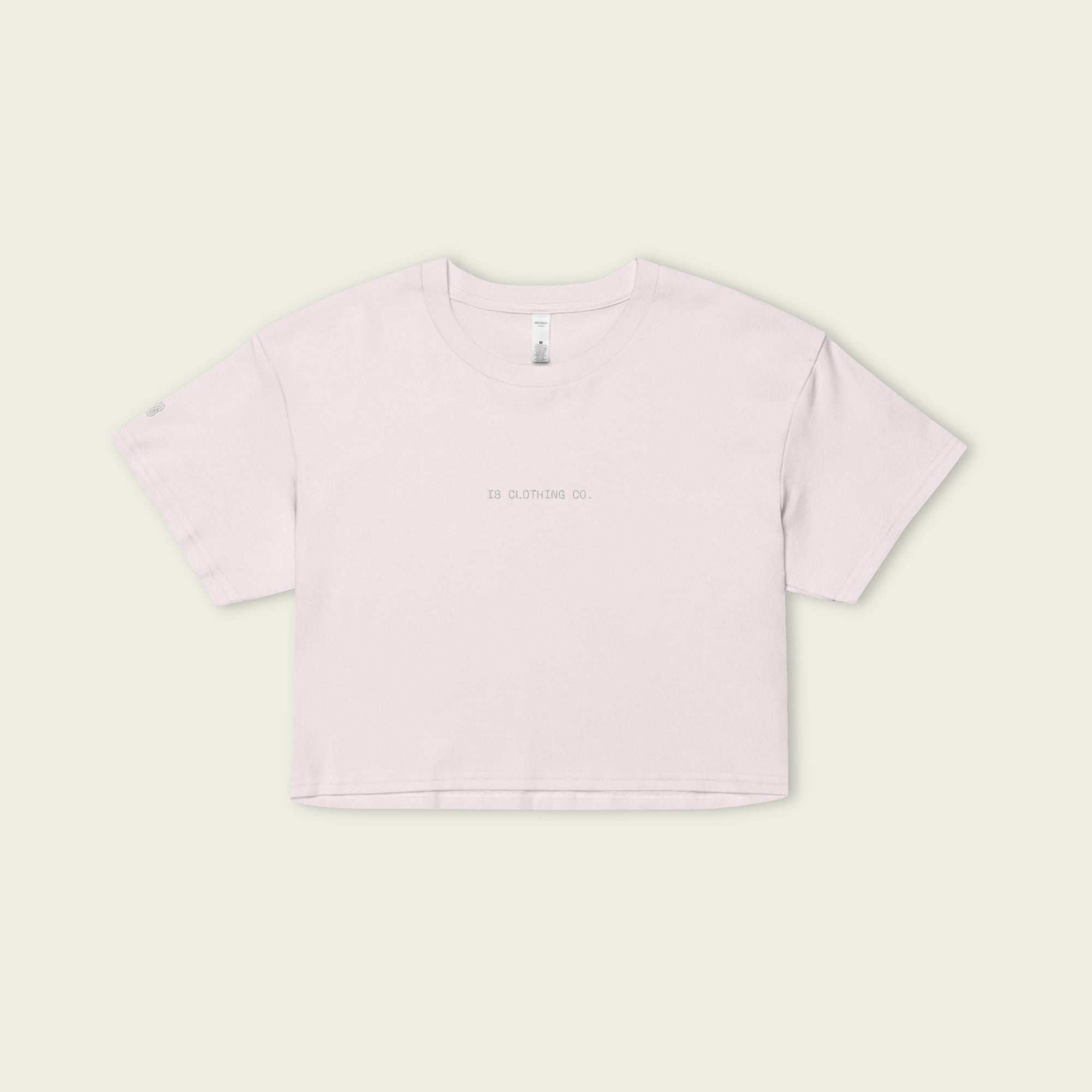 Light purple t-shirt on a light green background