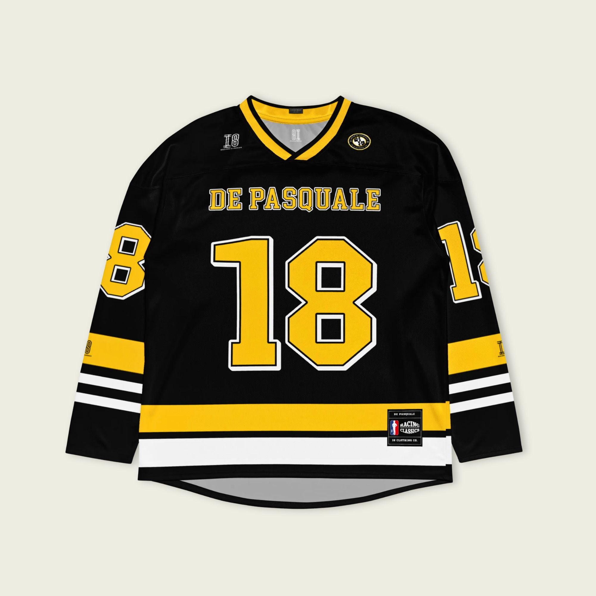 Black hockey jersey with yellow and white accents, featuring the name 'De Pasquale' and number '18'.