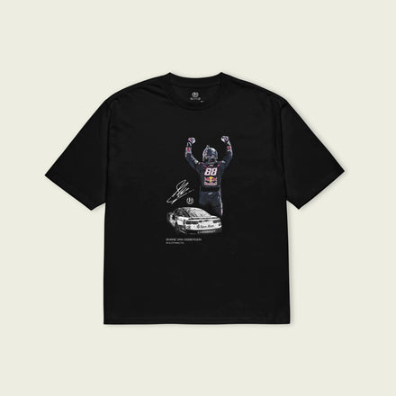 Black t-shirt with graphic design of a person and car on a beige background