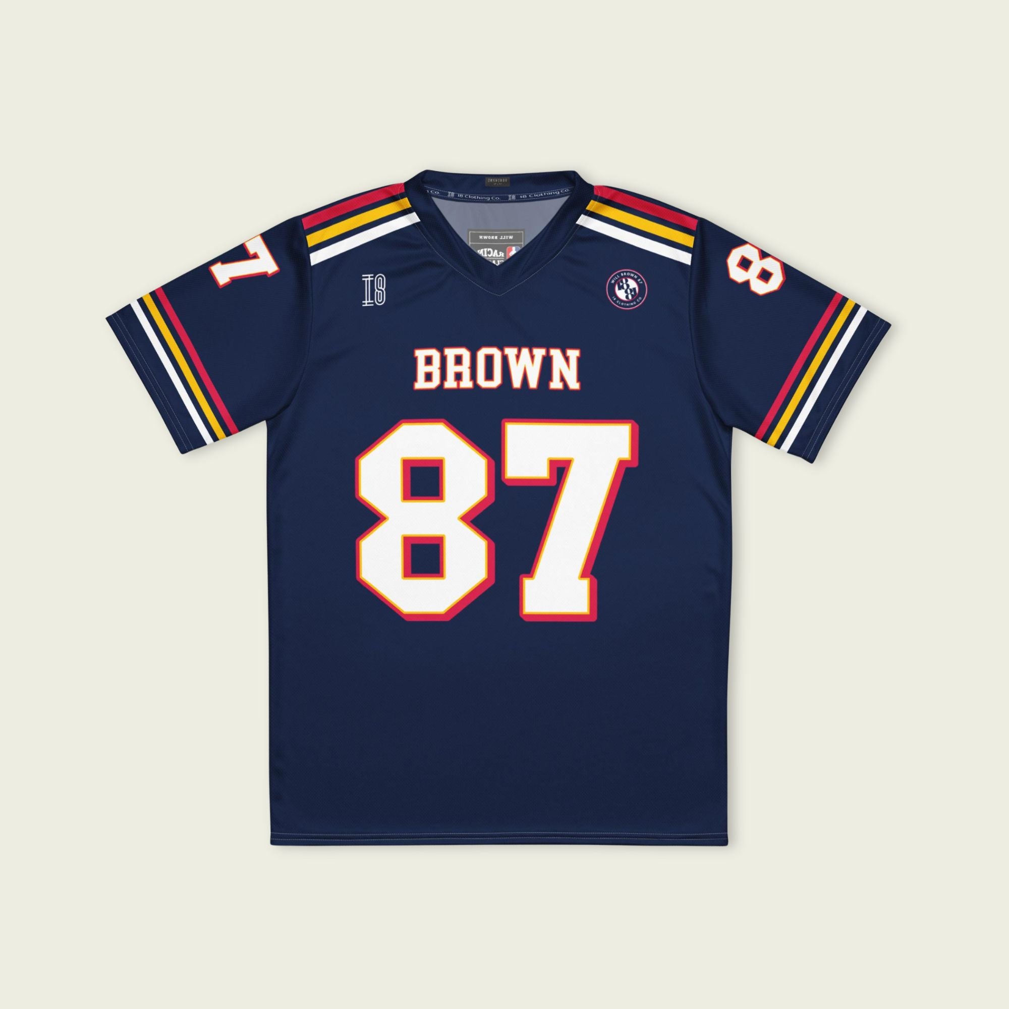 Navy blue sports jersey with 'Brown 87' on a beige background