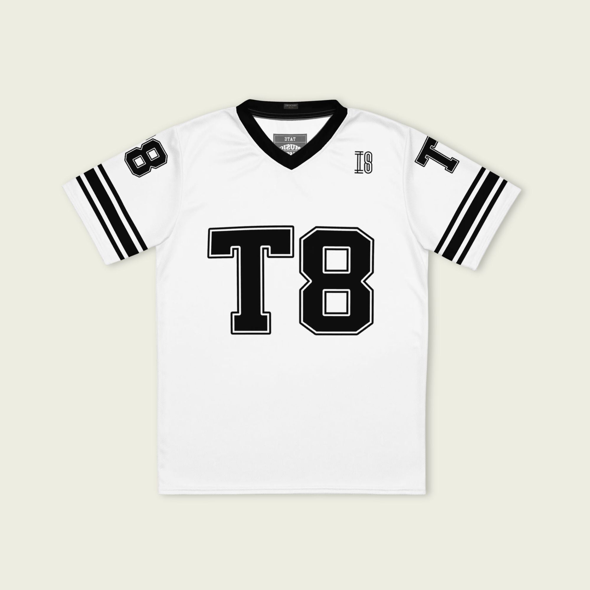 A black and white football jersey with Tate Mcare on the back and front in white with a white  outline.