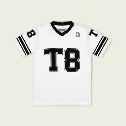 A black and white football jersey with Tate Mcare on the back and front in white with a white  outline.