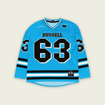 A blue hockey jersey with three stipes on the bottom the middle one is white and the bottom and top are black. It has the number 63 that George Russell races with in F1 that is filled with black and a white outline, it is displayed on the back and front. Also there is text on the front and back "Russell"