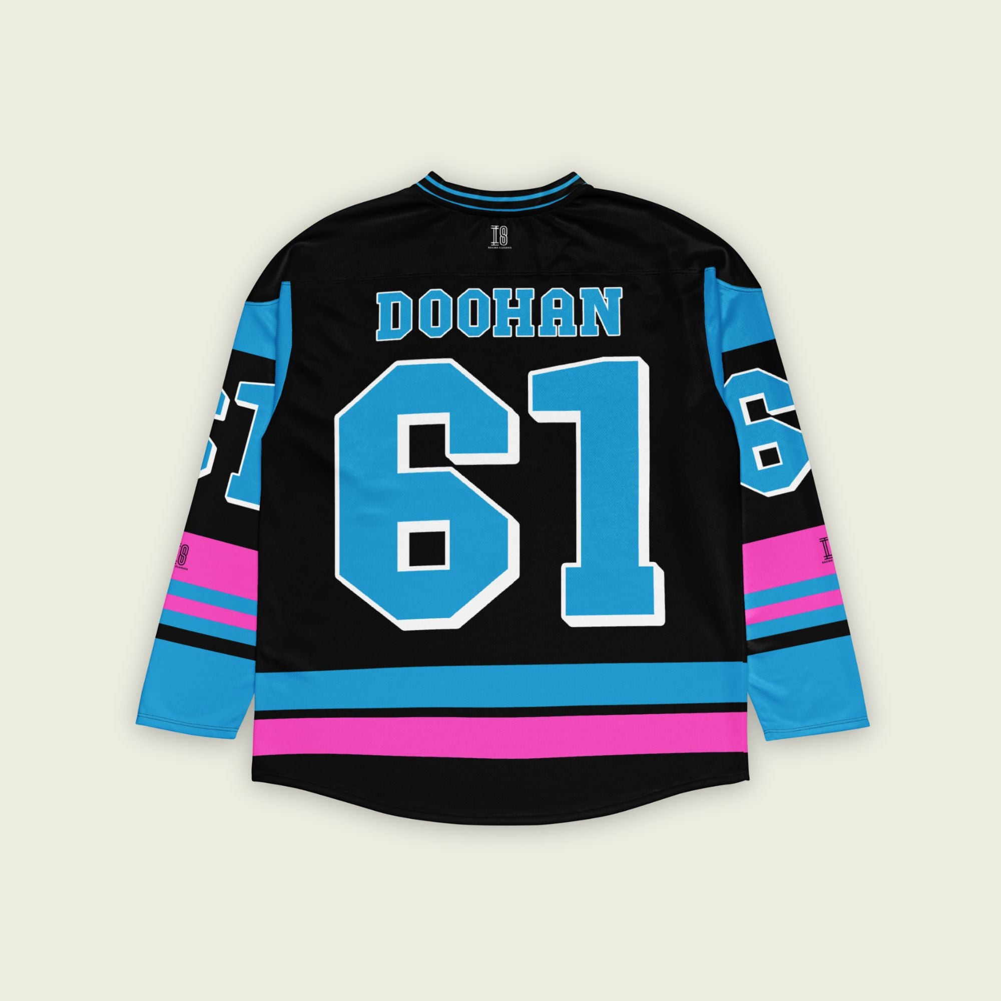 A black, blue, and pink hockey jersey with Jack Doohan's F1 2025 Alpine racing number 61 on the front and back in blue. The name Doohan in blue is on the front and back.
