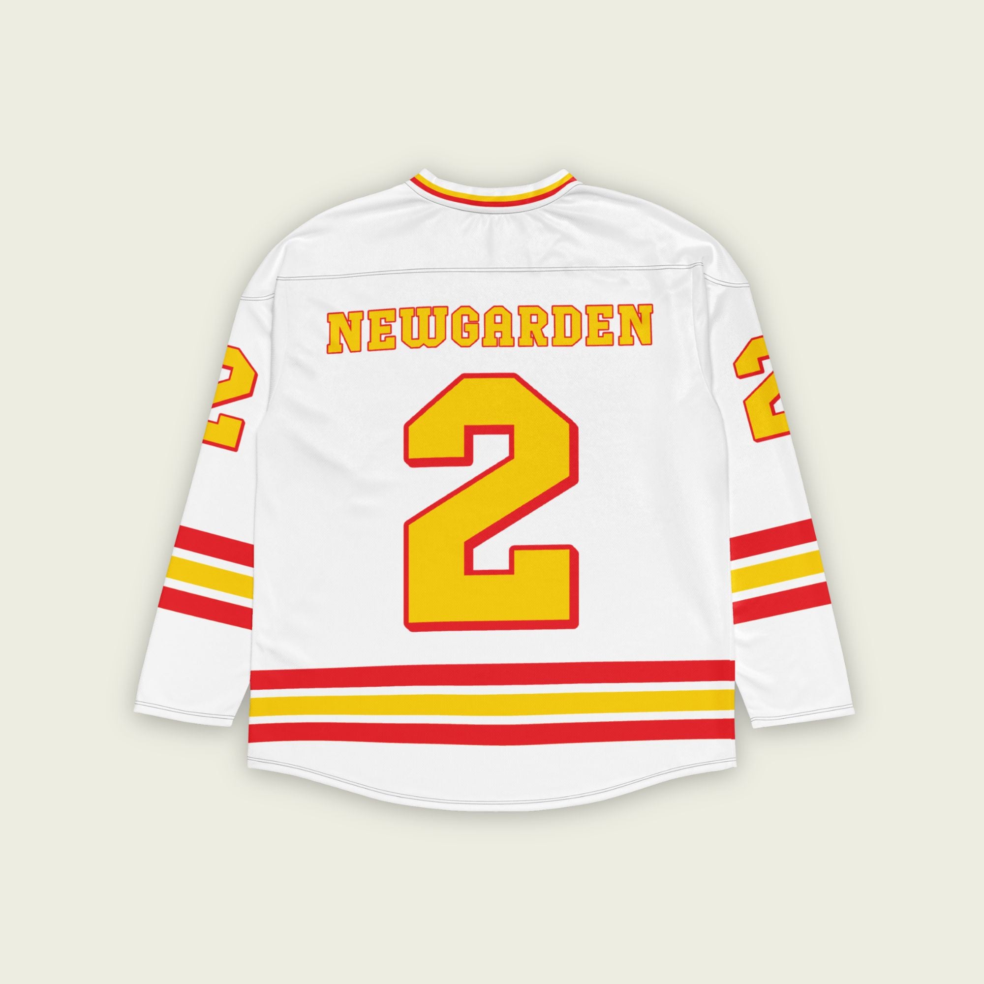 A white hockey jersey with yellow and red stripes. It has Newgarden's indycar racing number 2 and the name newgarden on the front and back in yellow with a red outline.