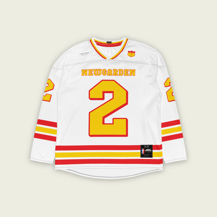 A white hockey jersey with yellow and red stripes. It has Newgarden's indycar racing number 2 and the name newgarden on the front and back in yellow with a red outline.