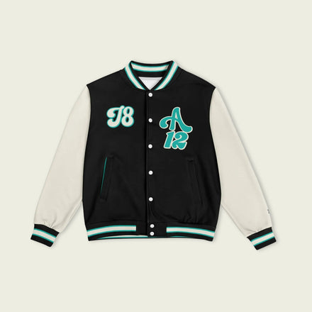 A navy petronas green, black, and tan, varsity jacket with Kimi Antonelli's Mercedes F1 racing number 12 in green on the front and back.