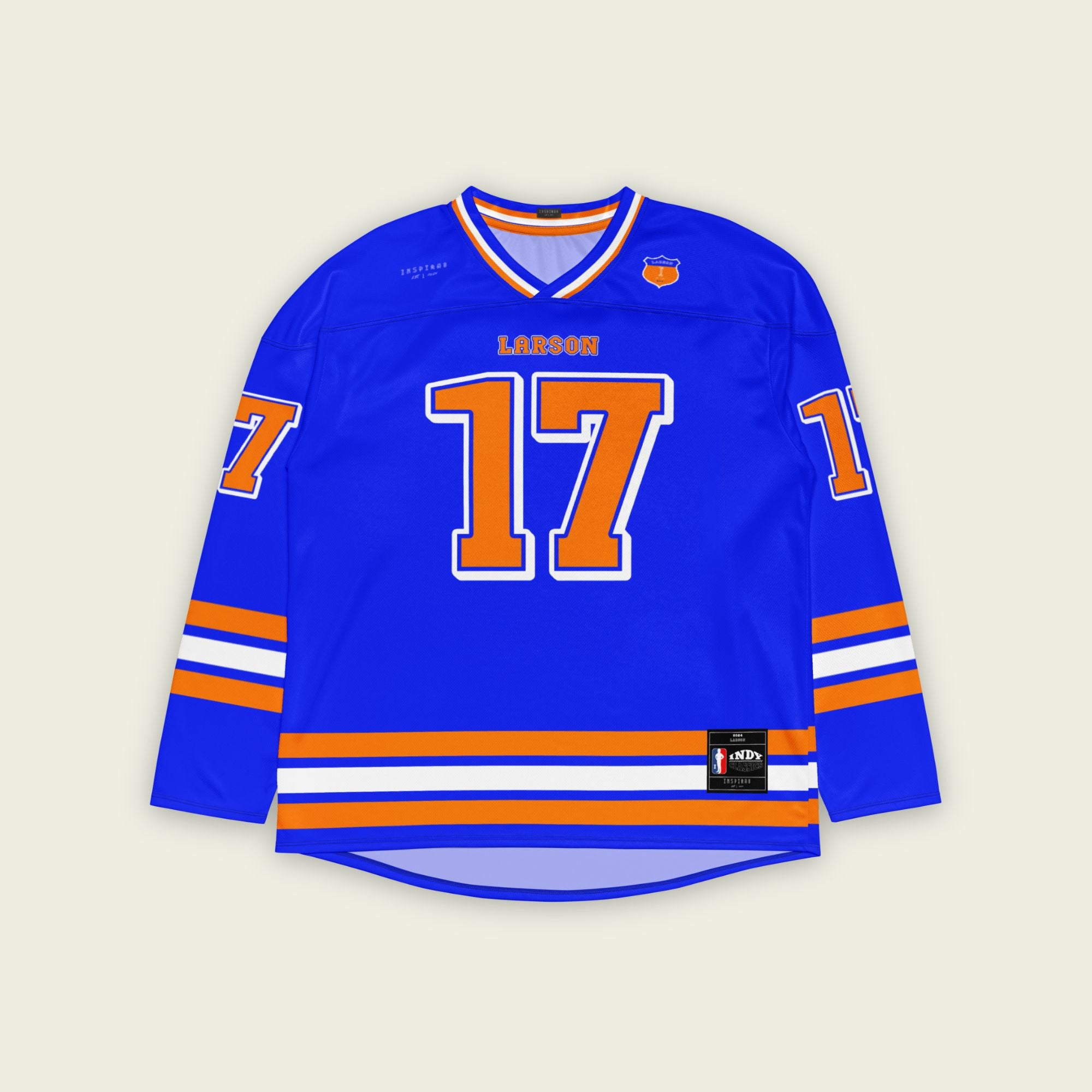 A blue hockey jersey with kyle larson indycar racing number 17 in oragne with a white outline. THe name