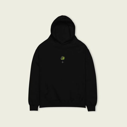 A black oversized hoodie with  white text Lando on the front  and lando norris's neon green helmut on the front.