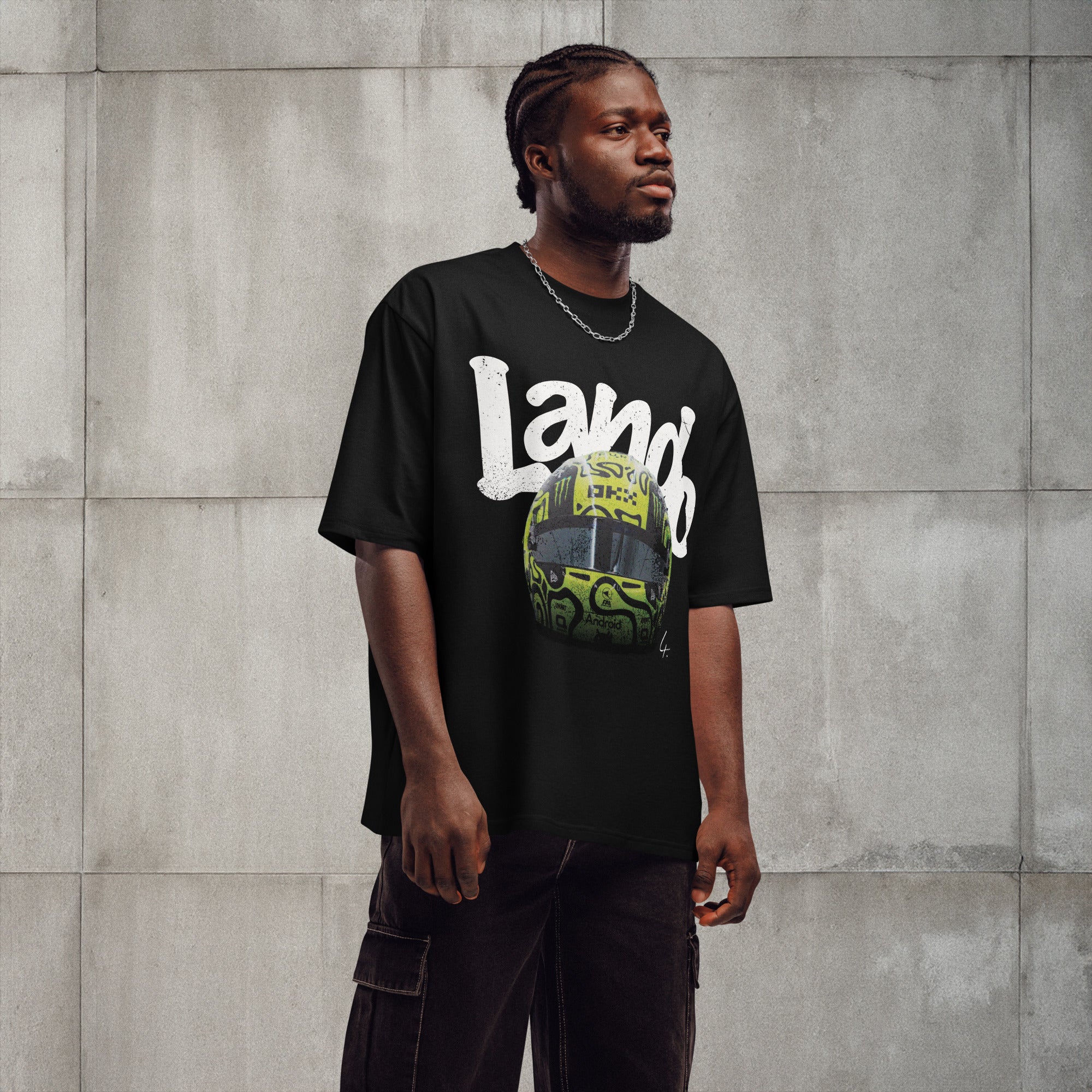 A black oversized TShirt with white text Lando on the front  and lando norris's neon green helmut on the front.