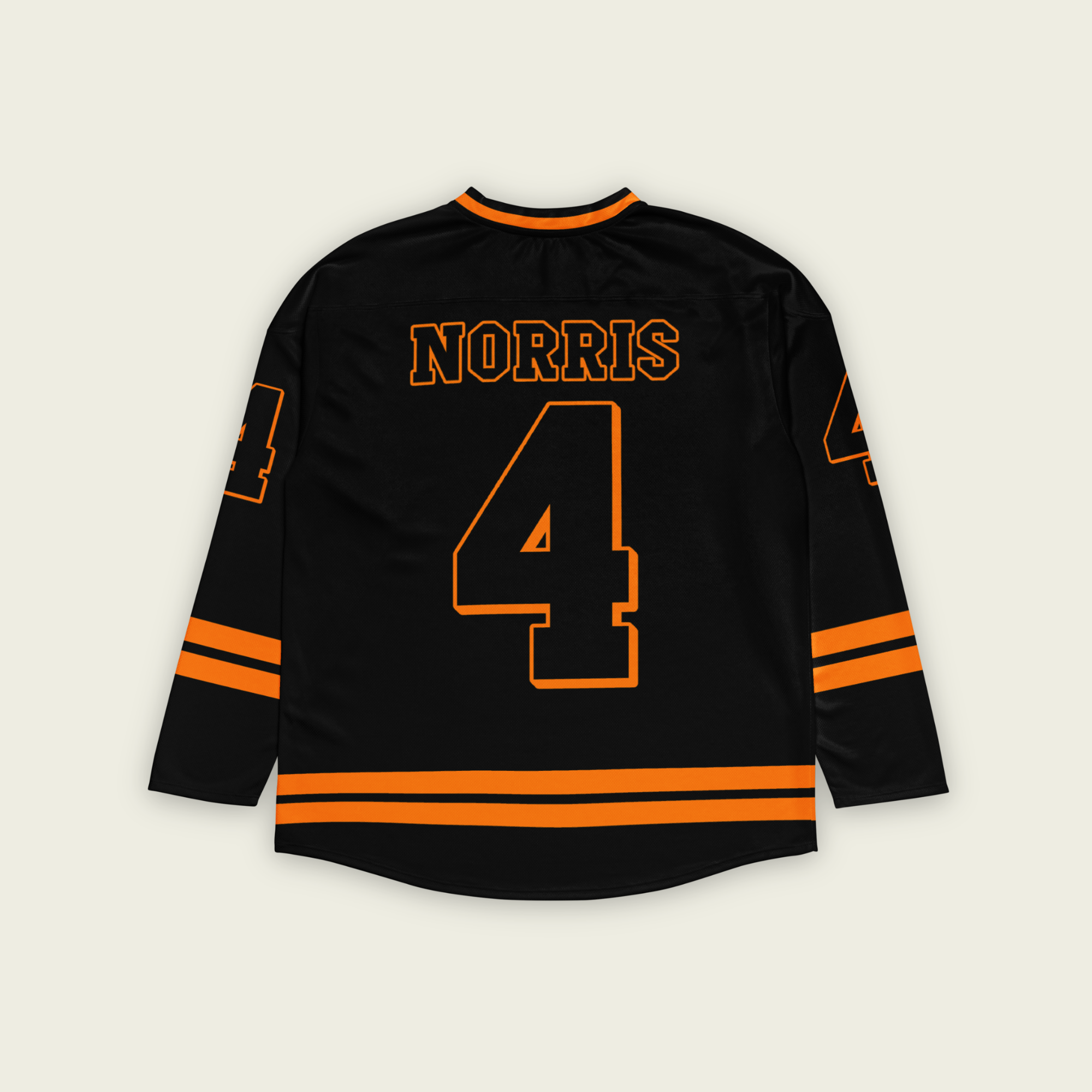 A black hockey jersey with Lando Norris's last name and McLaren F1 racing number 4 on the front and back in orange.